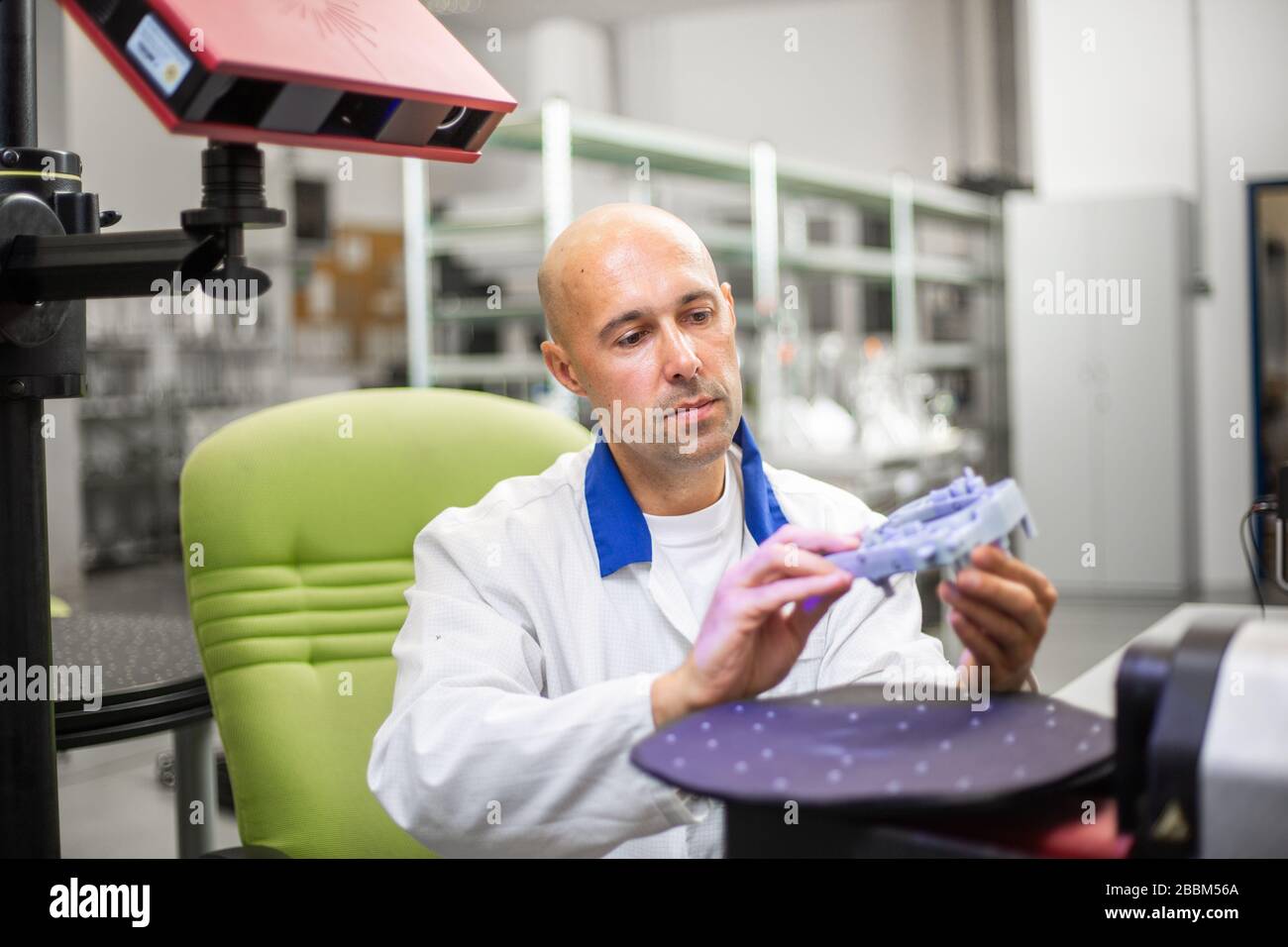 Quality engineer scanning some moldings component by professional