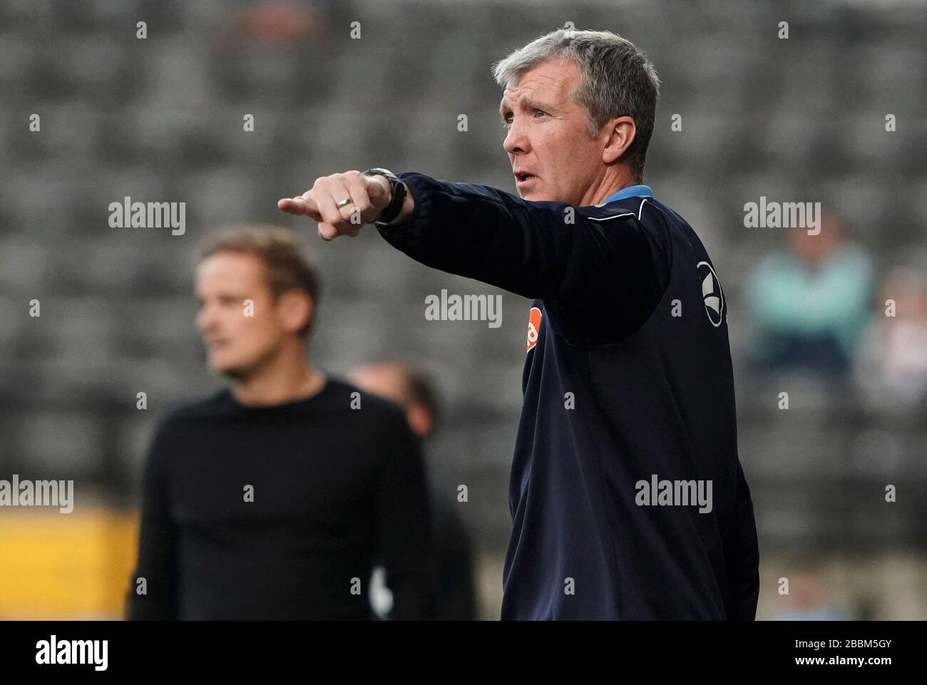Stockport County manager Jim Gannon gestures towards his players at