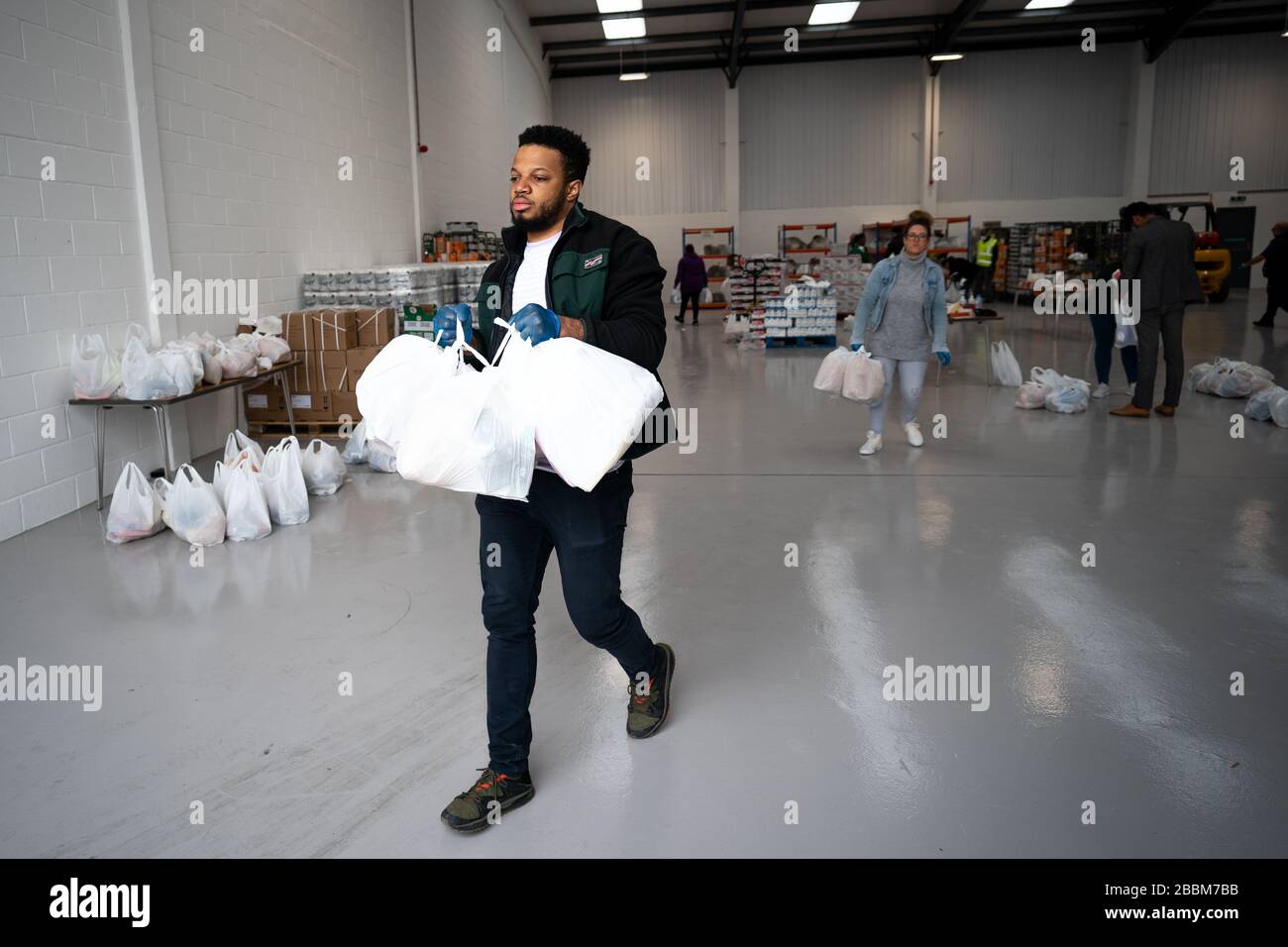 Volunteers help load a delivery van at the launch of Enfield Council's
