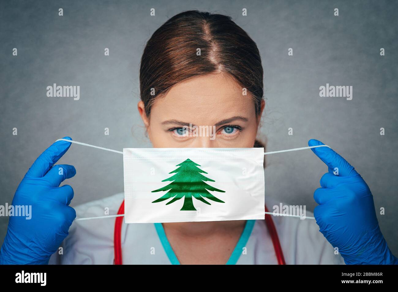 Coronavirus in U.S. State Naval Ensign of Massachusetts, Female Doctor Portrait, protect Face surgical medical mask with Flag. Illness, Virus Covid-19 Stock Photo