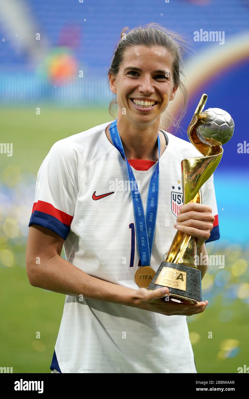 USA's Tobin Heath celebrates with the FIFA Women's World Cup Trophy