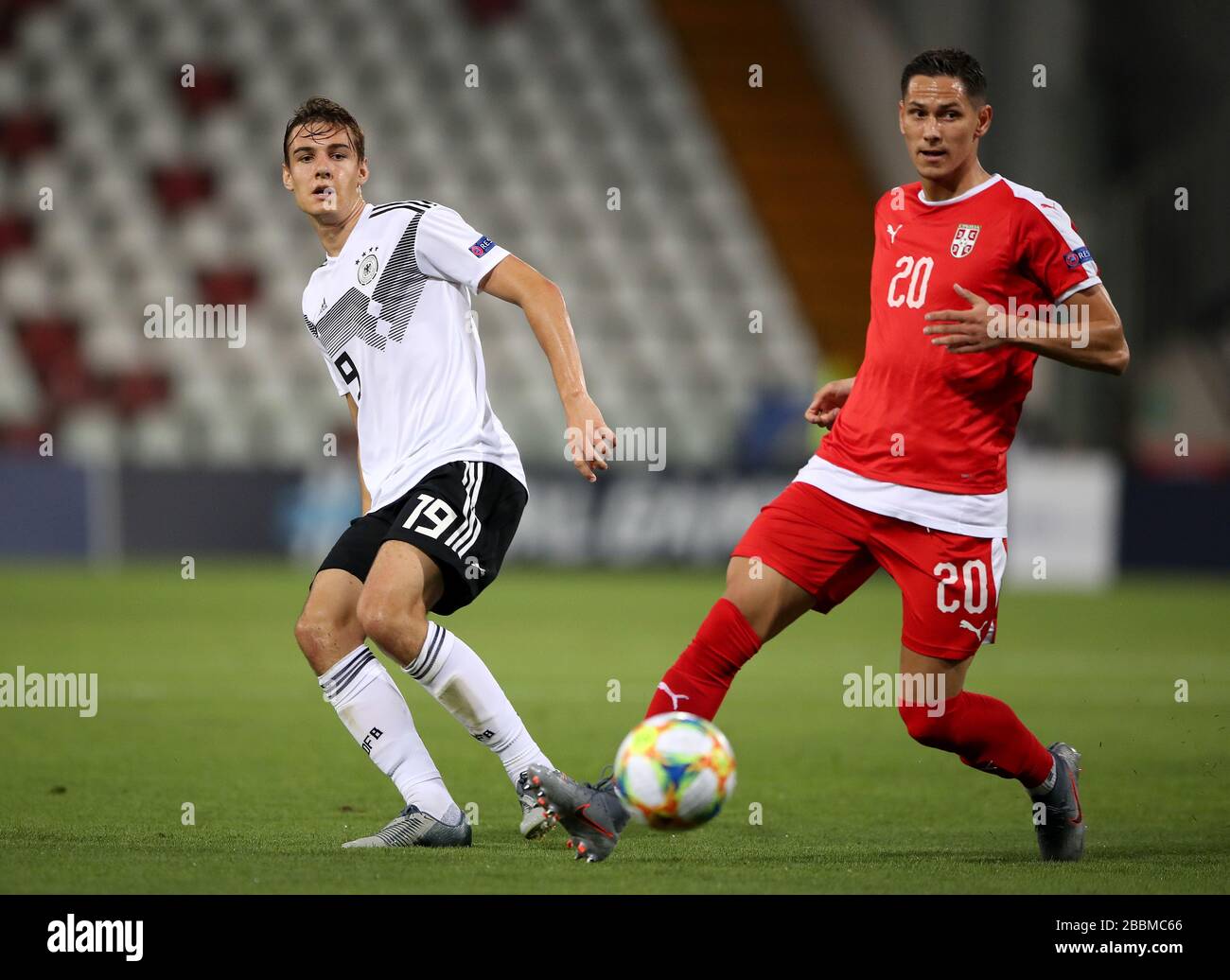 Germany U21's Florian Neuhaus (left) and Serbia U21's Sasa Lukic battle for the ball Stock Photo