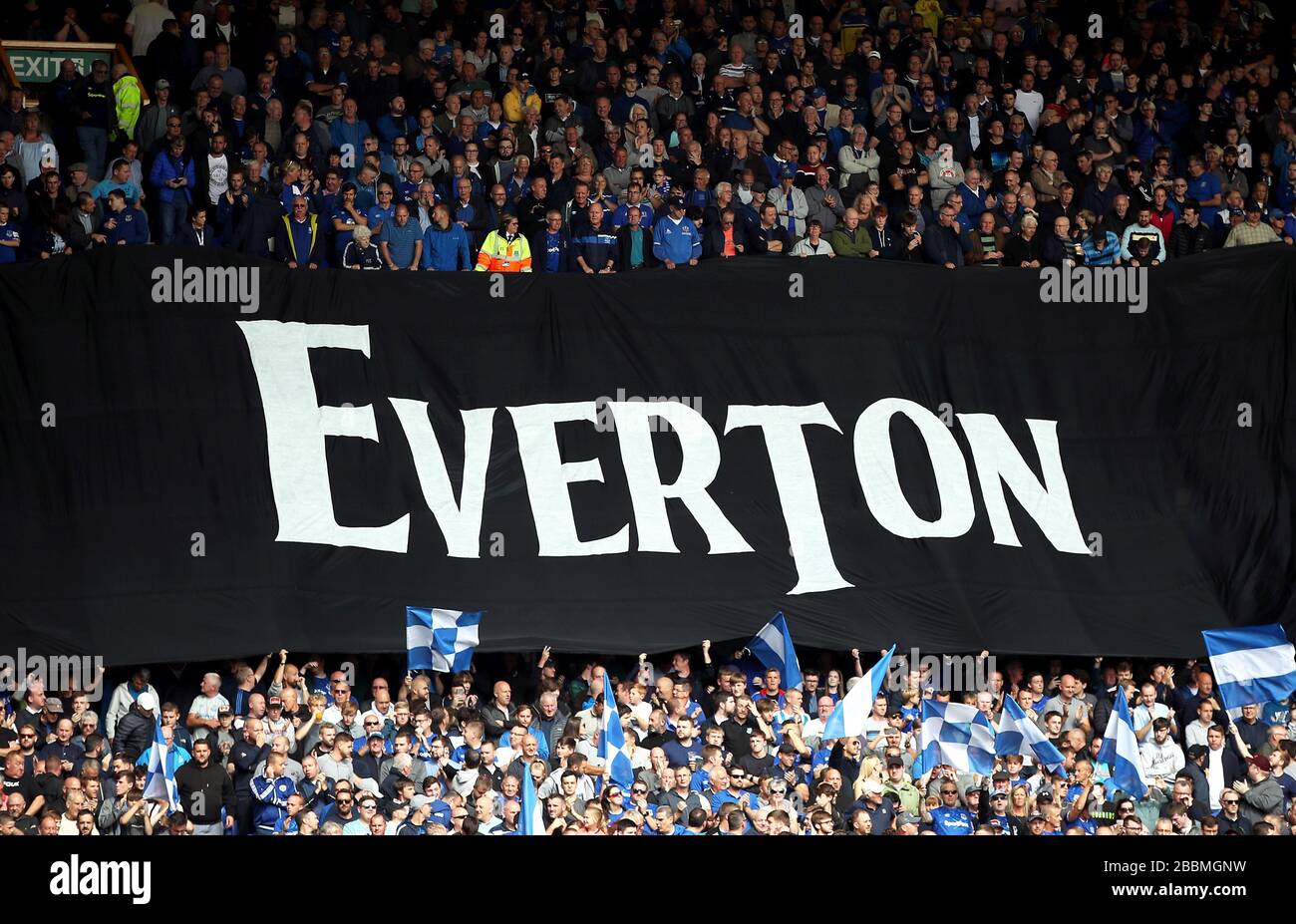 Everton fans with a large banner in the style of the Beatles font prior to kick-off Stock Photo