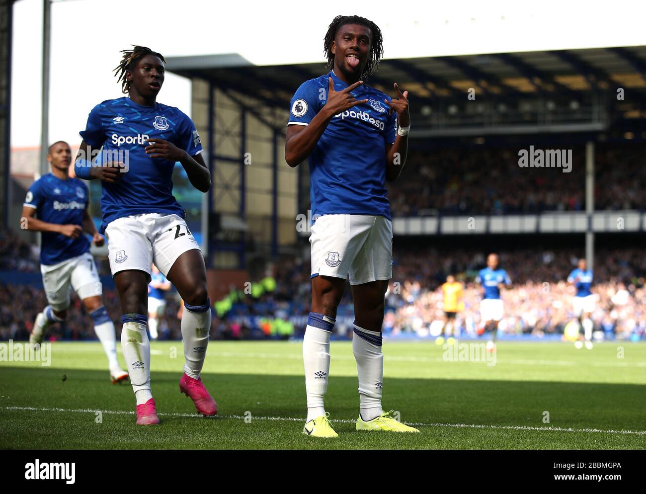 Everton's Alex Iwobi (right) celebrates scoring his side's second goal of the game with team-mates Stock Photo