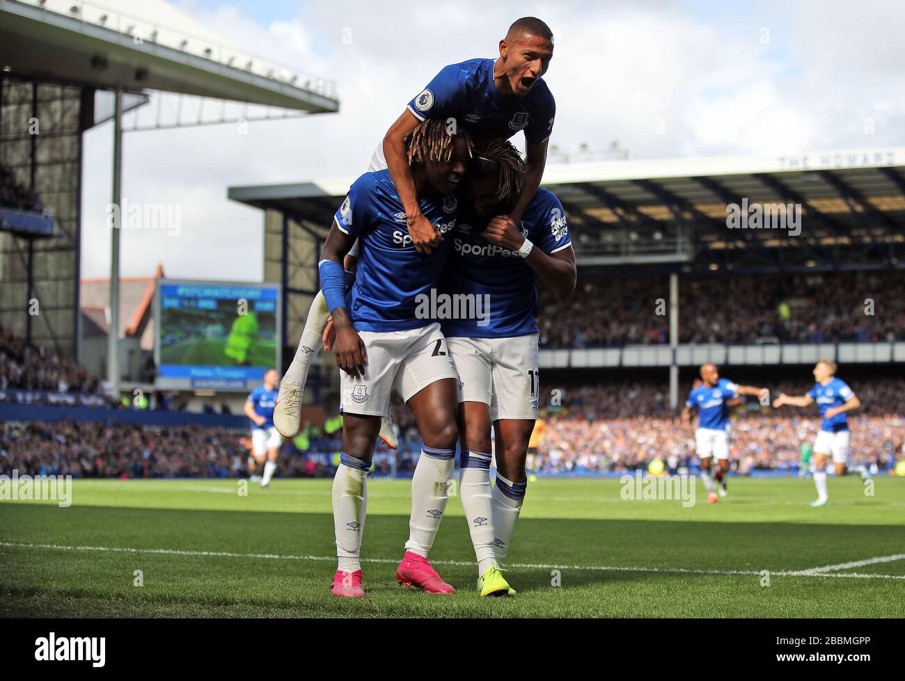 Everton's Richarlison (top) celebrates scoring his side's first goal of the game with team-mates Stock Photo