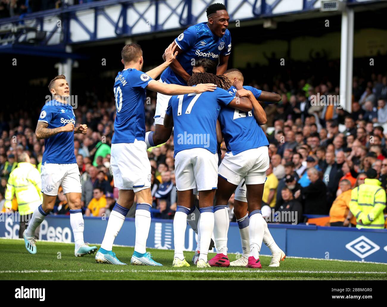 Everton's Richarlison (hidden) celebrates scoring his side's first goal of the game with team-mates Stock Photo