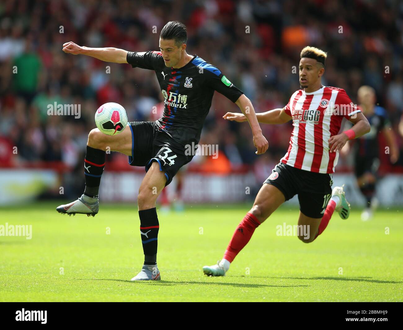 Sheffield United's Callum Robinson (right) and Crystal Palace's Martin Kelly battle for the ball Stock Photo
