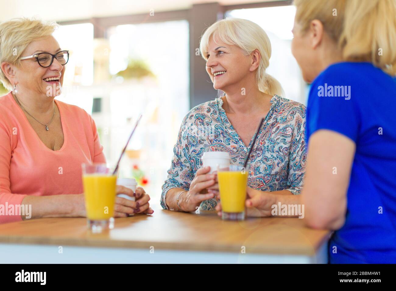 Three women standing outside hi-res stock photography and images - Alamy