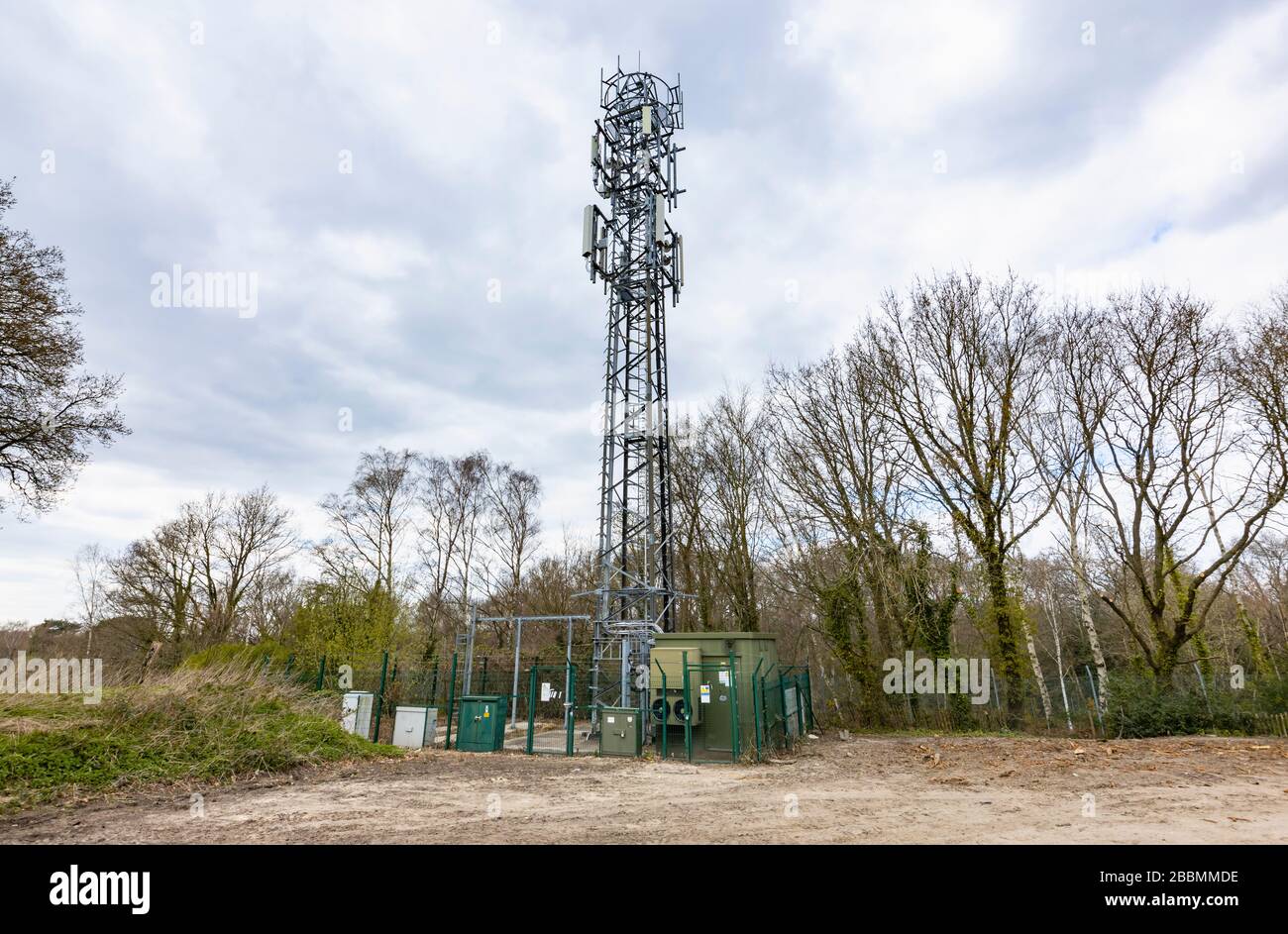 Tall steel lattice telecommunications tower forming part of the mobile telecommunications transmission network, Woking, Surrey, south-east England Stock Photo