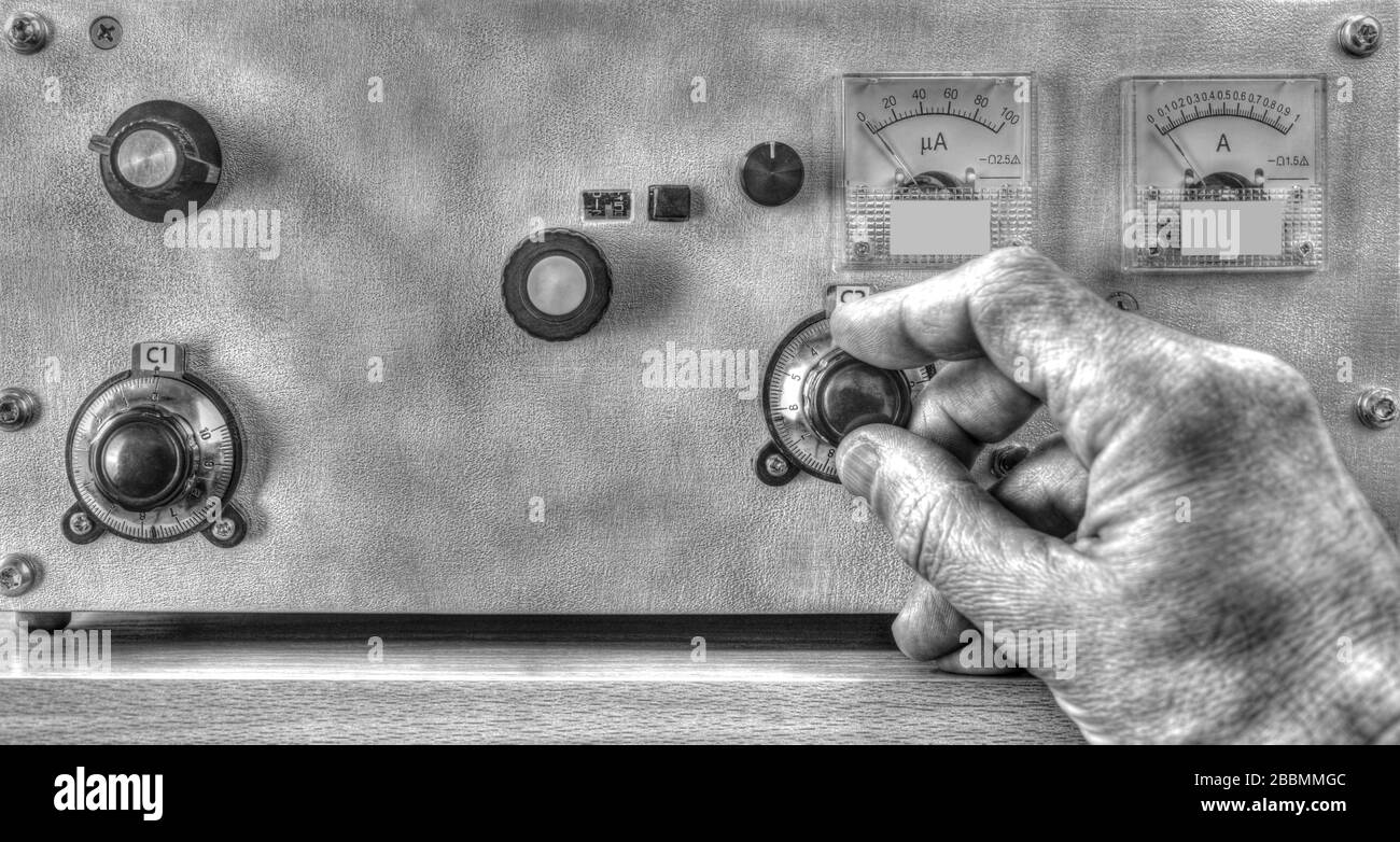 Close up view of radio amateur tuning the high frequency power