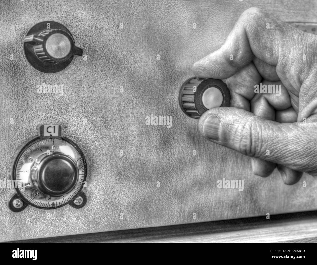 Close up view of radio amateur tuning the high frequency power amplifier in black and white Stock Photo