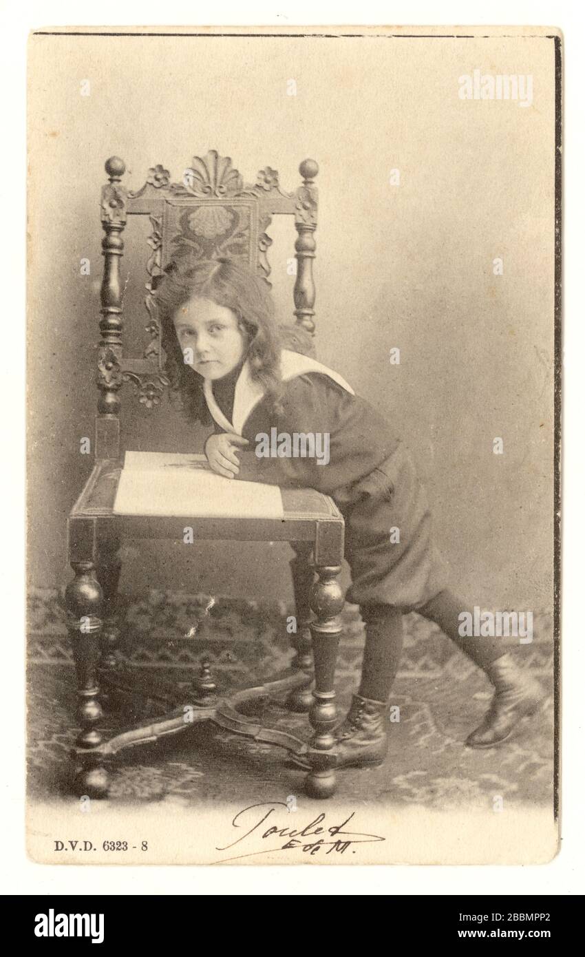Early 1900's Belgian postcard, boy with long hair and sailor suit, undivided back, Belgium, posted April 1900 Stock Photo