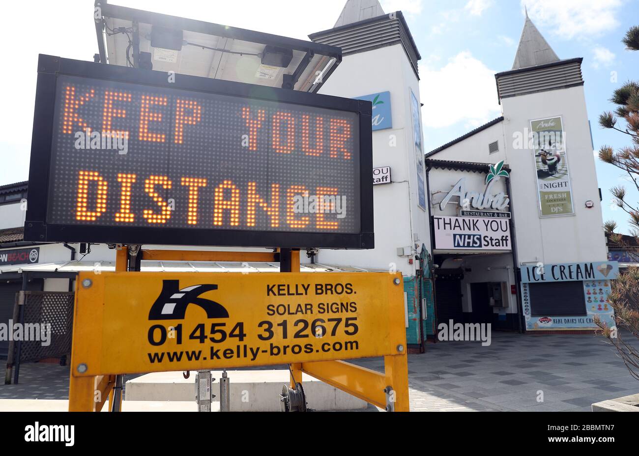 A Keep your Distance sign near to Bournemouth Pier, as the UK continues ...