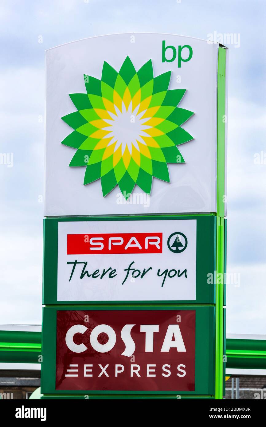 Filling station sign indicating BP fuel, an in store SPAr shop and Costa Coffee express cafe Stock Photo