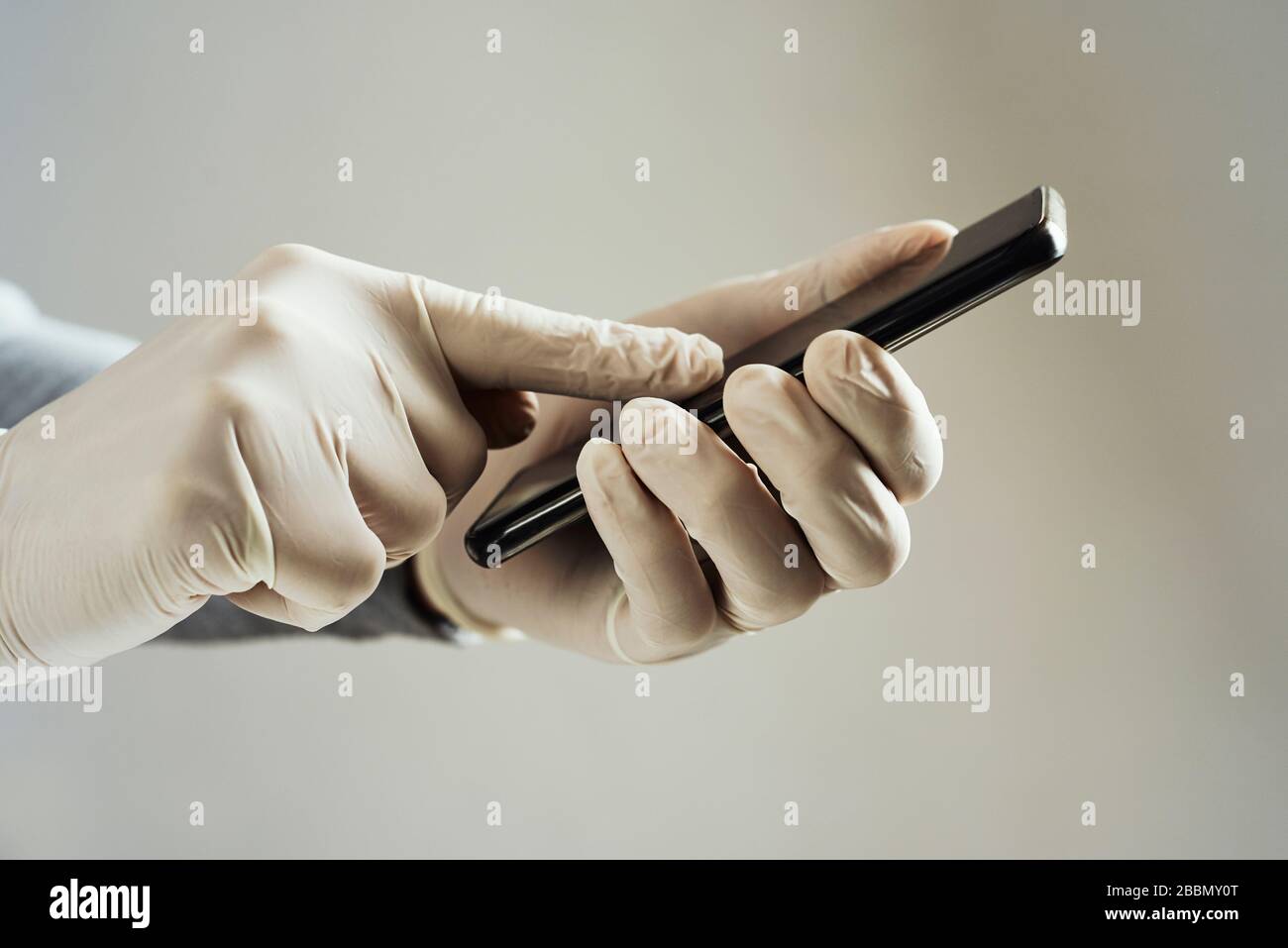 Wearing latex gloves hi-res stock photography and images - Alamy