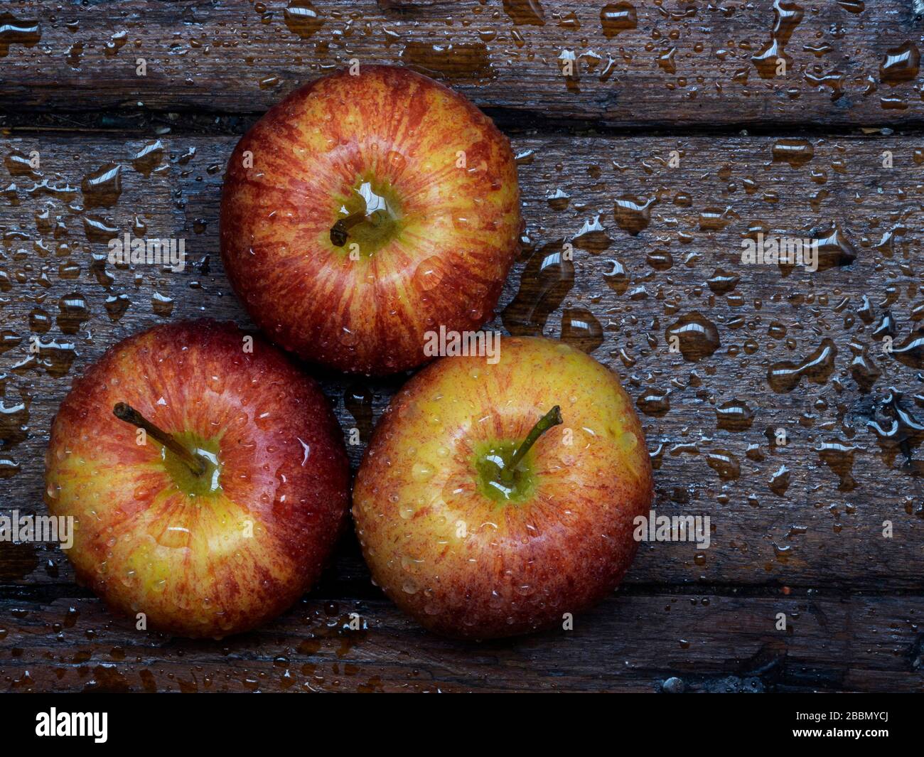 Top view of three red apples on table Stock Photo