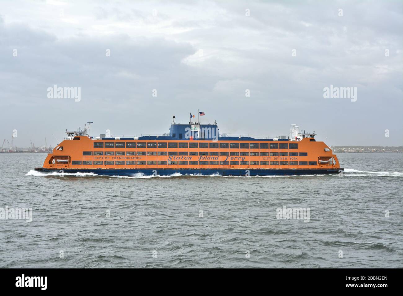 NEW YORK CITY, USA - OCTOBER 15, 2014: Staten Island Ferry departs for Manhattan. The ferry carries over 21 million passengers a year Stock Photo
