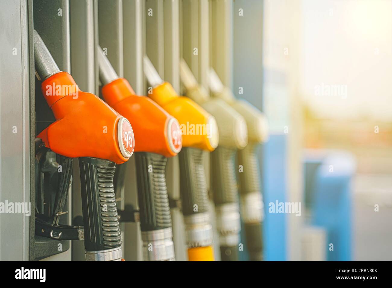 Gas station. Gas pump nozzles on the petrol station Stock Photo Alamy