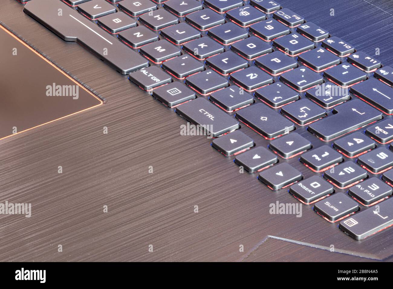 Spanish keyboard laptop with the characteristic letter Ñ of the Spanish alphabet and illuminated keys Stock Photo