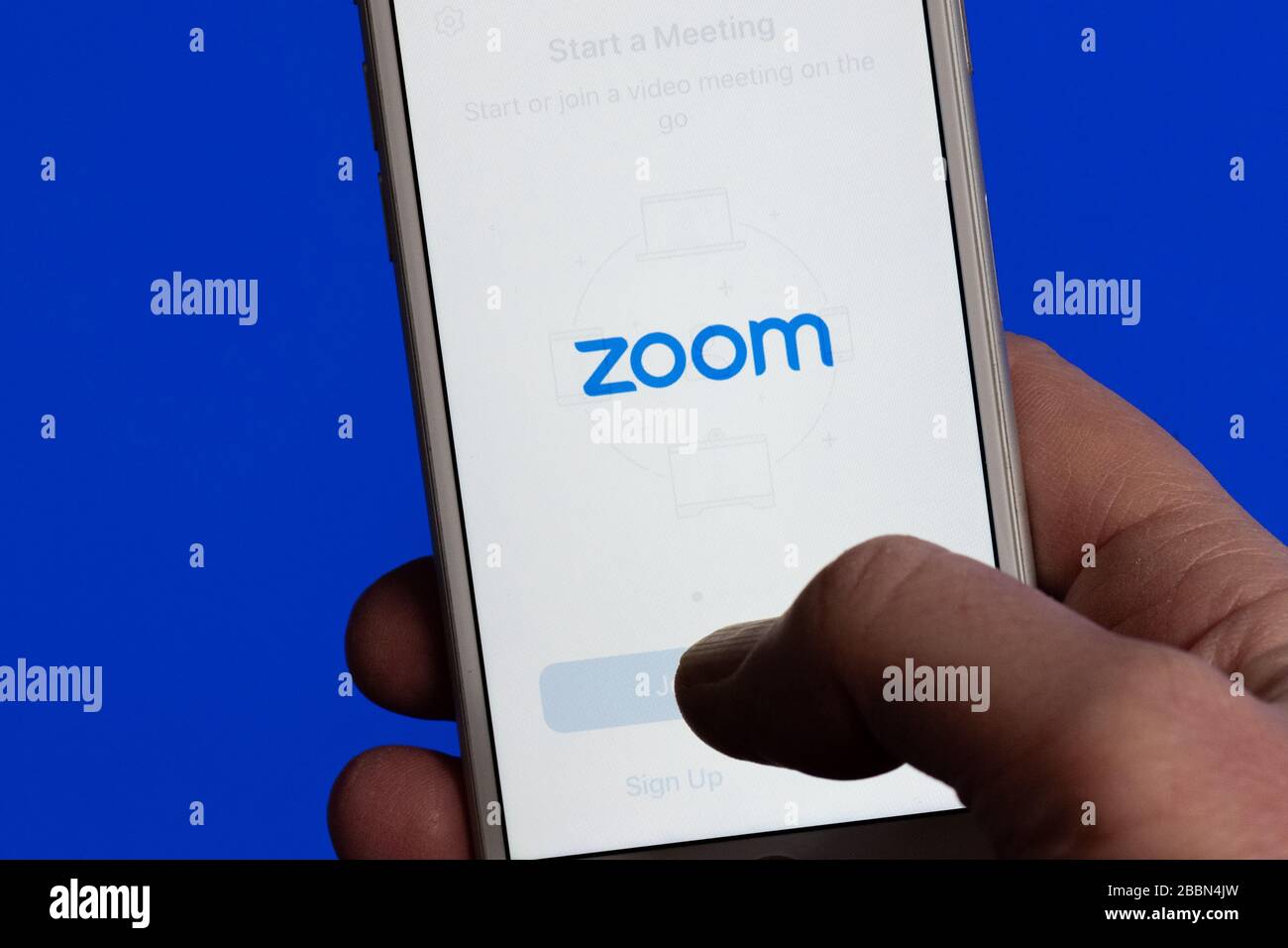 Zoom video conferencing app on phone Stock Photo