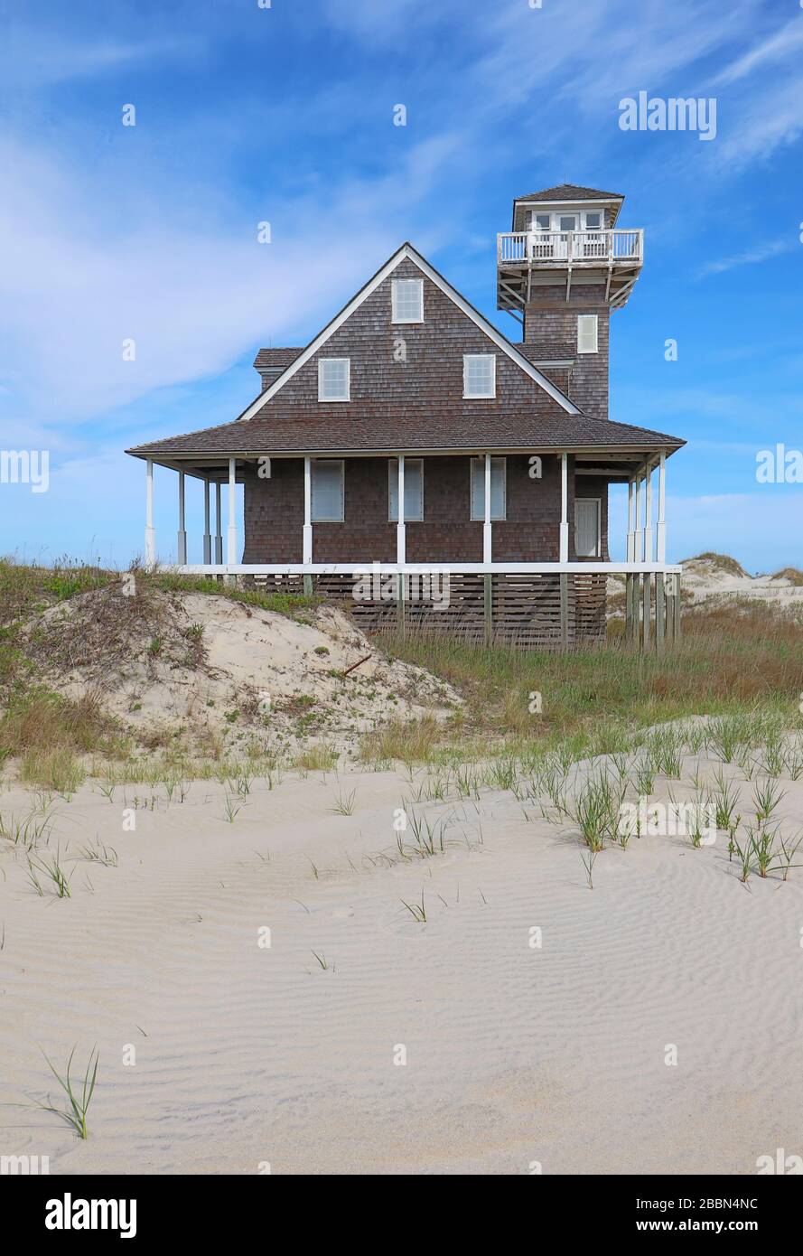 Historic Oregon Inlet life-saving station on Pea Island near Rodanthe, on the outer banks of North Carolina vertical Stock Photo