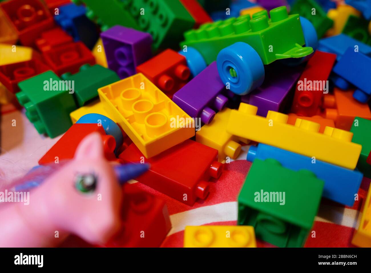 Blocks to play with childrens. A lot of colors to play. A head of pony Stock Photo