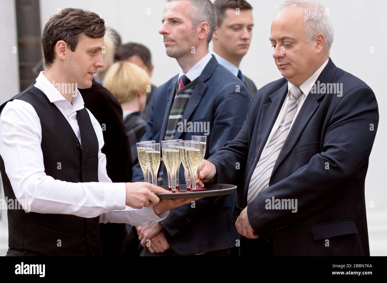Waiter carrying tray hi-res stock photography and images - Alamy