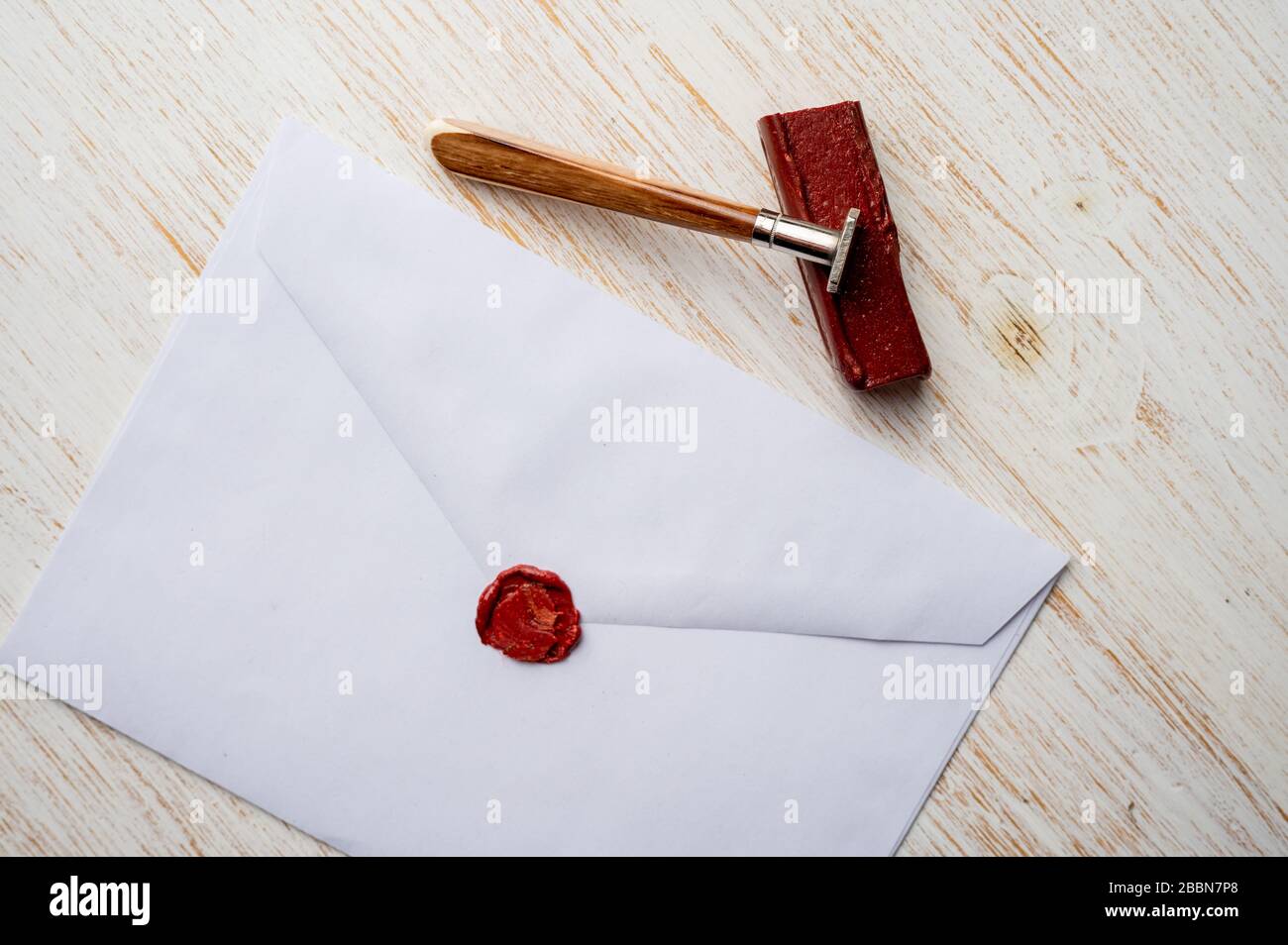 Envelope Ink Stick Vintage ink pen in female hand, white letter envelope, seal and ...