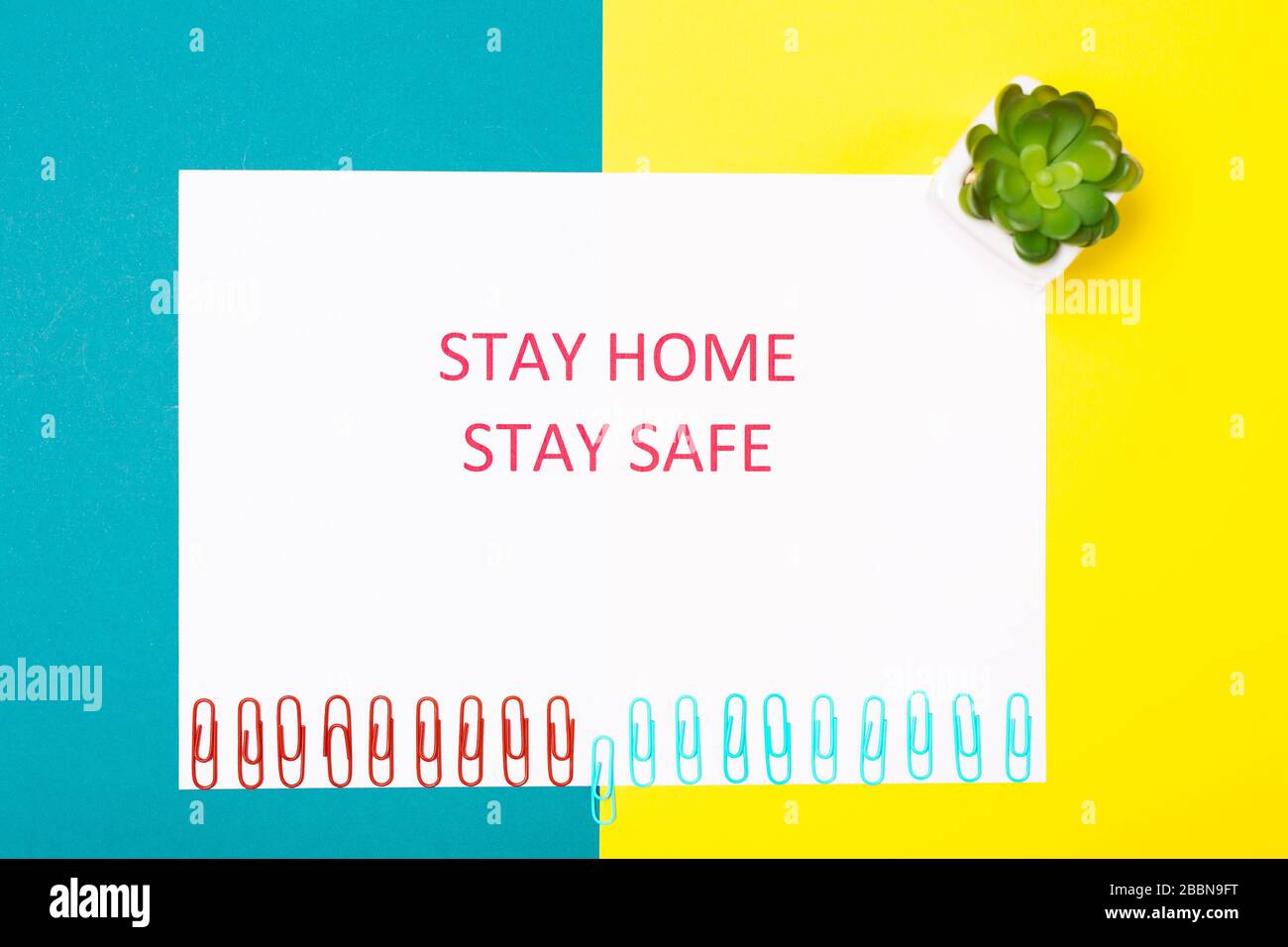 Coronavirus Pandemic Protection Concept. Words stay at home. Minimal concept. Stay safe, how to stop coronavirus from spreading. Social Distancing Stock Photo
