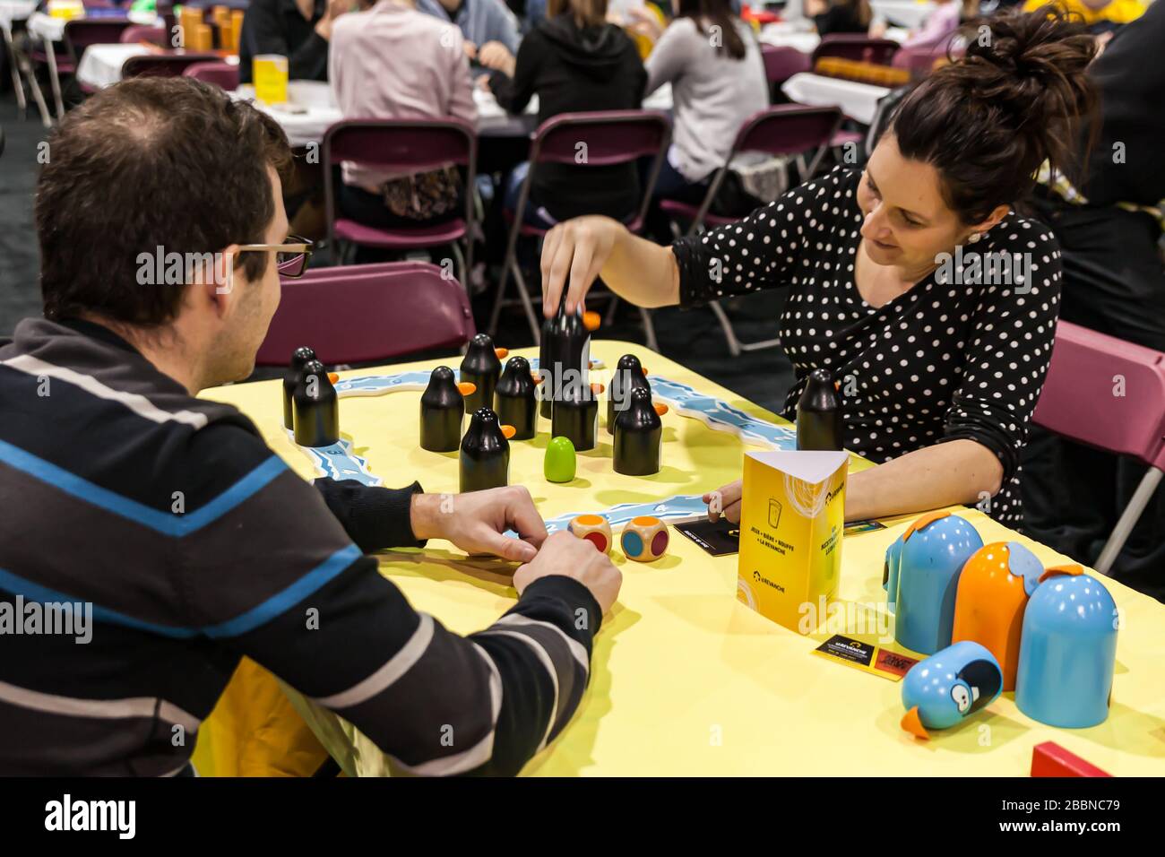 People playing at “Pengoloo” at the game and toy fair of Quebec City La Revanche, board game