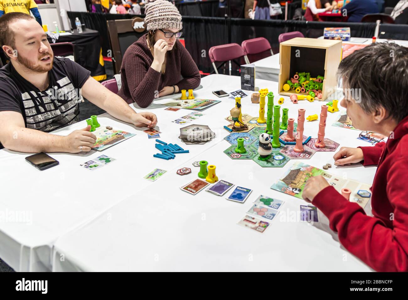 People playing at “Takenoko Collector’s Edition” at the game and toy fair of Quebec City La