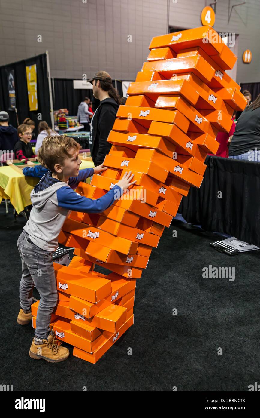 People playing at “Jenga Giant” at the game and toy fair of Quebec City -  La Revanche, board game, ExpoCité fair center Stock Photo - Alamy