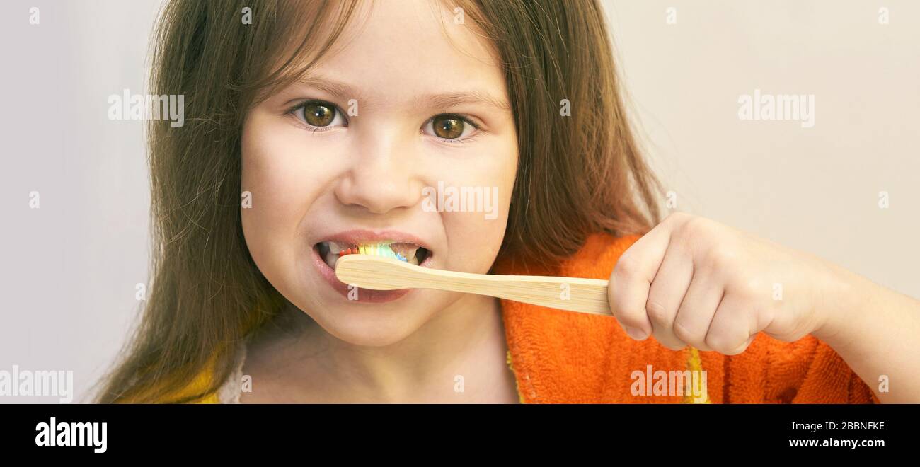 Kid brush teeth. Young woman dental care. Female baby at bathroom. Little girl Stock Photo