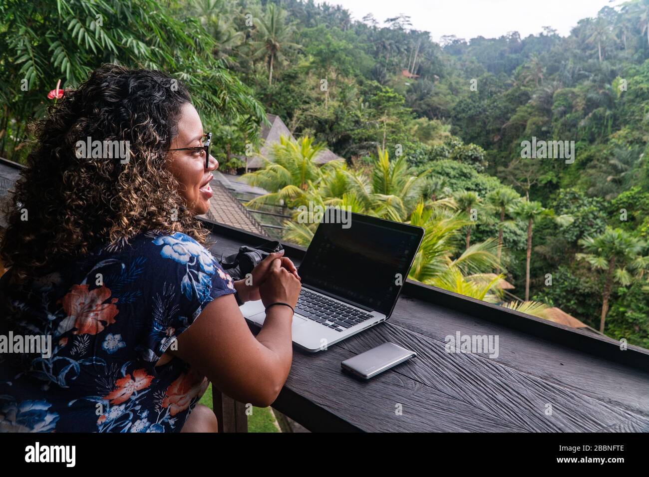 Working on laptop in an exotic location Bali Indonesia Stock Photo