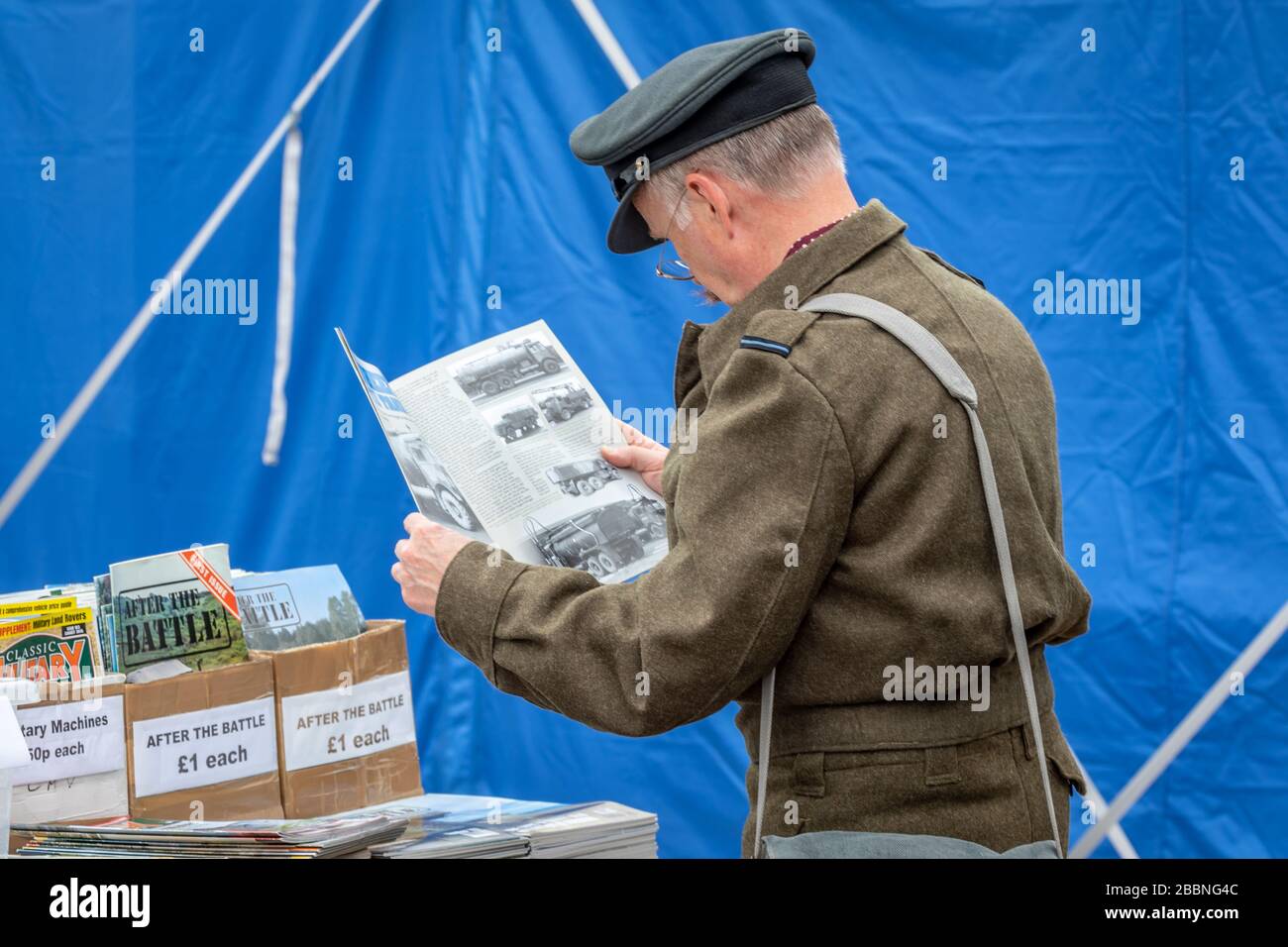 An airman 'checks the facts' during the Daks over Normandy event at IWM Duxford, Duxford Airfield, Cambridgeshire, UK Stock Photo