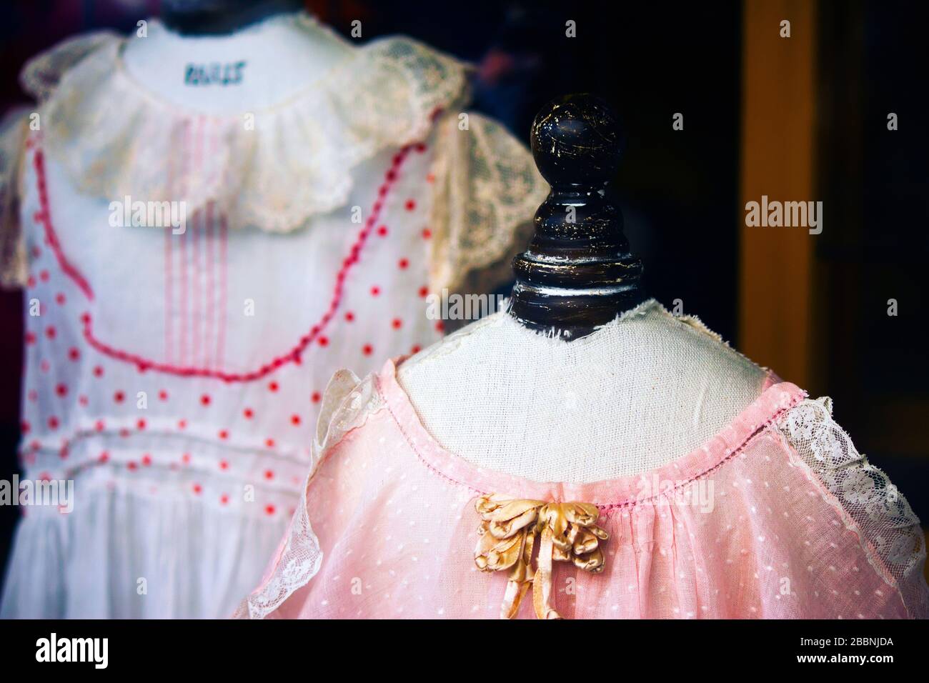 vintage little girl's dresses as shop display Stock Photo - Alamy