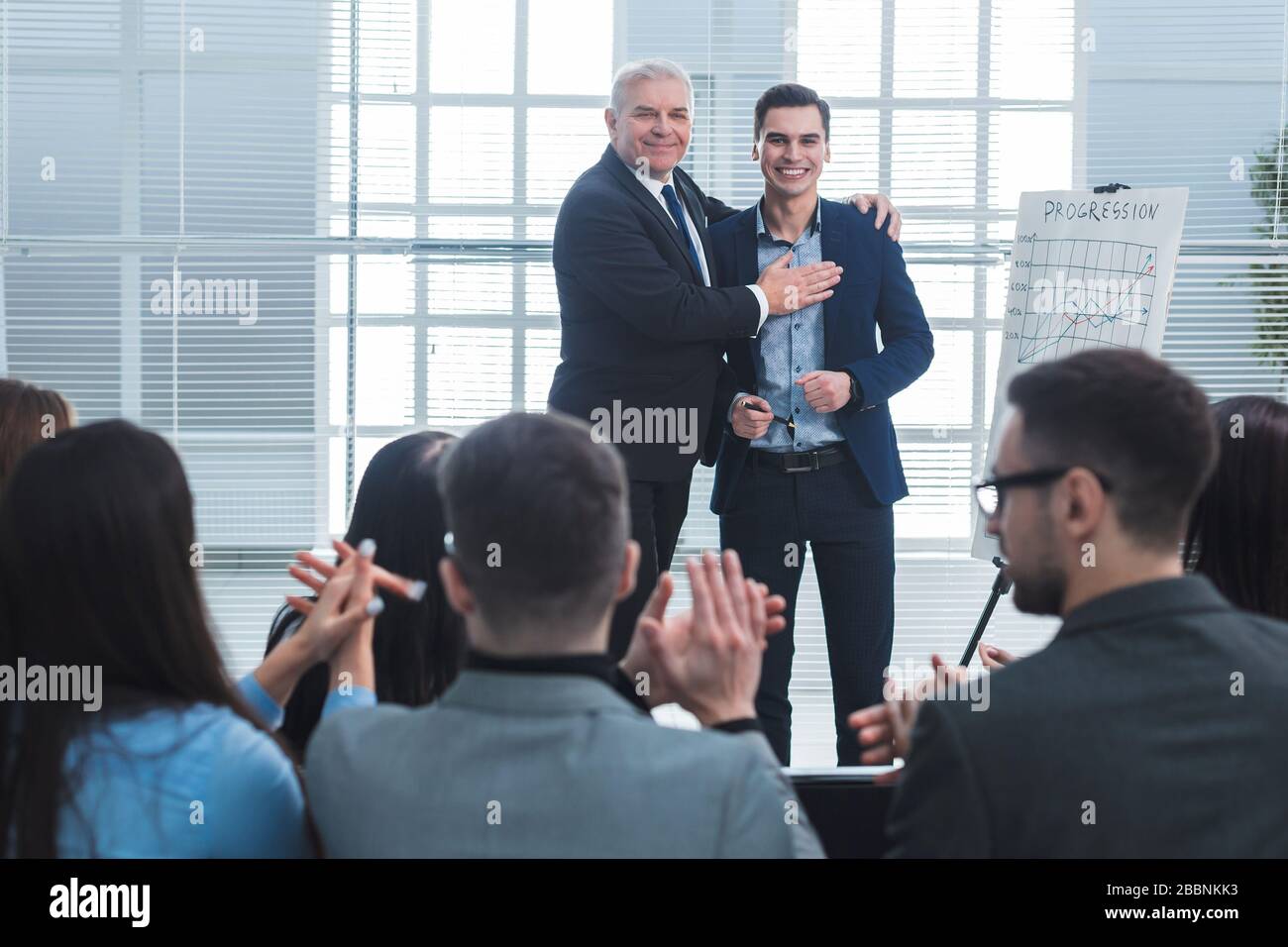 Project Manager Congratulations project Manager congratulating the best employee of the company Stock ...