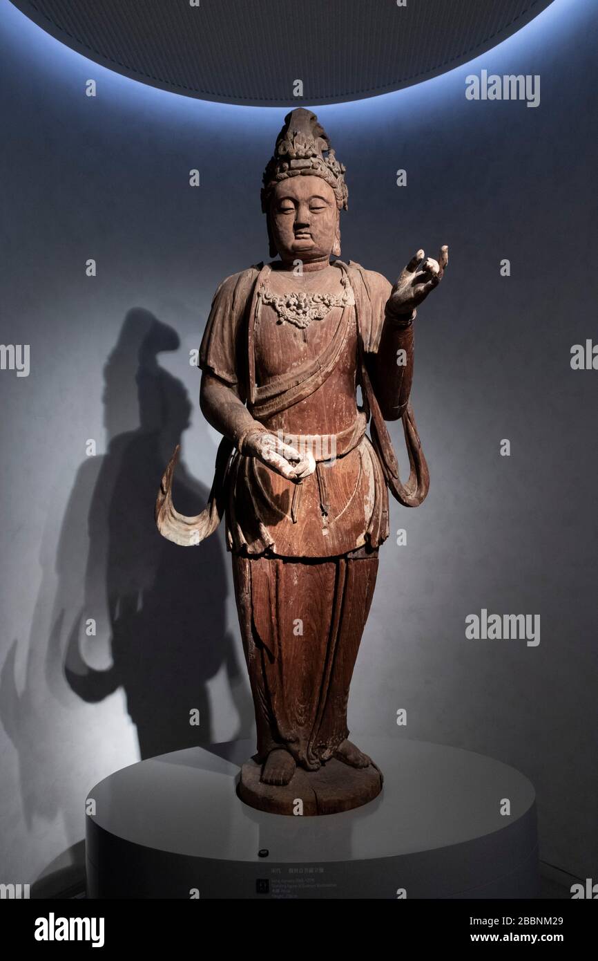 wooden standing figure of Guanyin Bodhisattva, Song dynasty, Aurora Art Museum, Shanghai, China Stock Photo