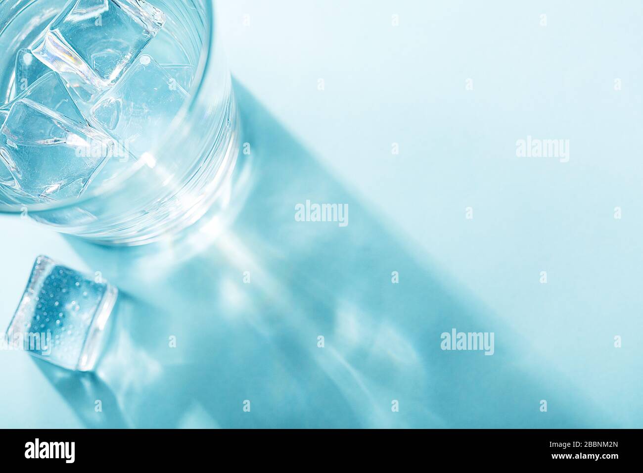 Colored banner with fresh ice cubes and reflections Stock Photo