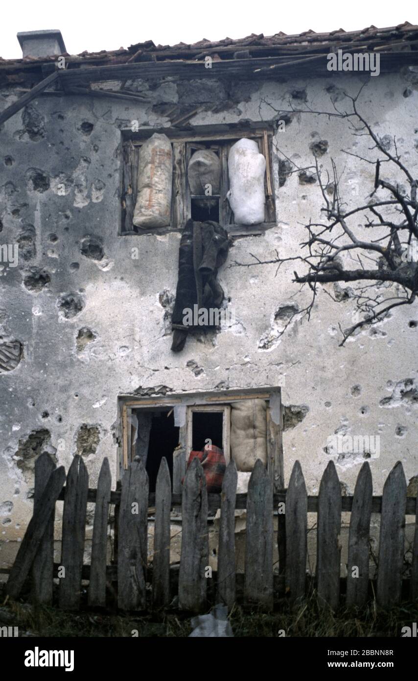 26th January 1994 During the war in central Bosnia: a battle-scarred house pockmarked with bullet and shrapnel scars in the Bosnian Muslim village of Here, two days after its capture by soldiers of the HVO's Rama Brigade. Stock Photo
