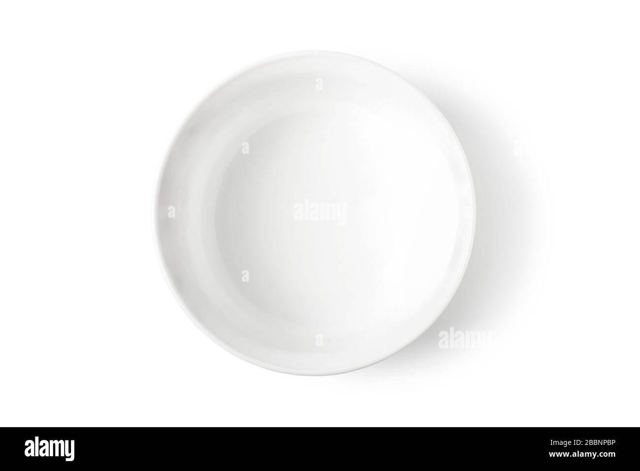 Deep white porcelain dish isolated on white. View from above Stock Photo