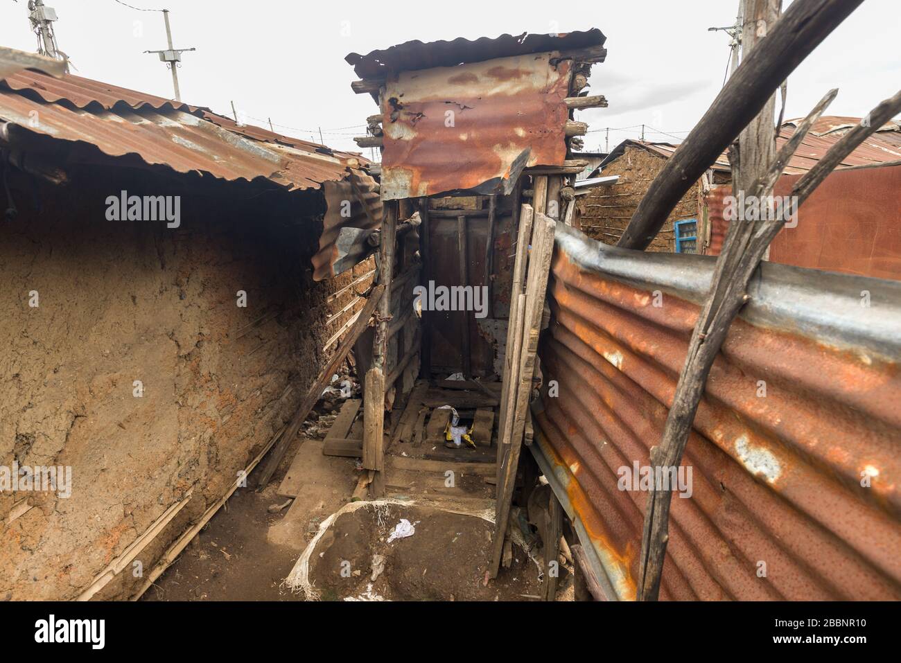 Typical slum wooden corrugated metal pit latrine or drop toilet outhouse, Nairobi, Kenya Stock Photo