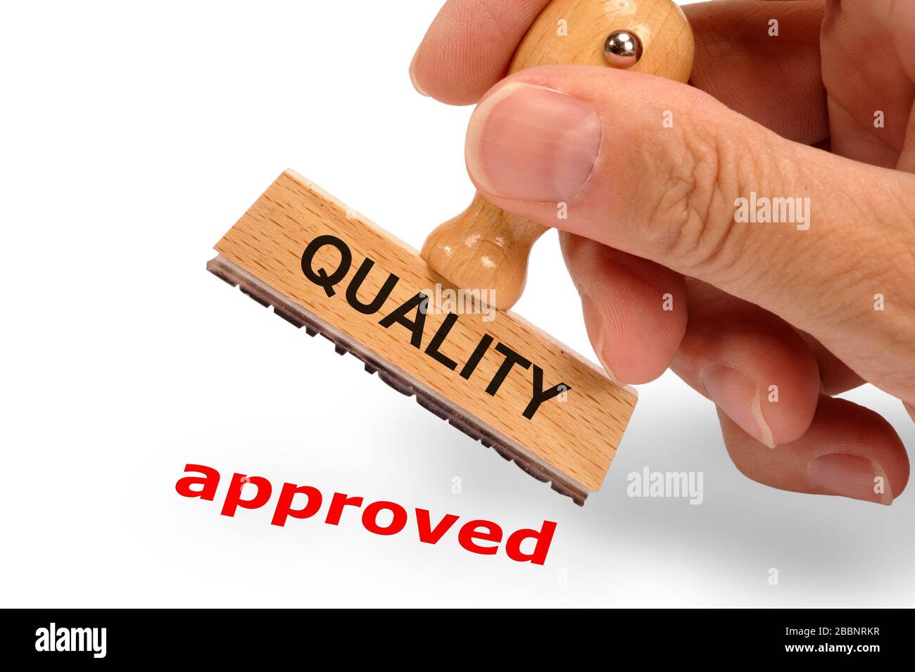 approved printed on rubber stamp in hand Stock Photo