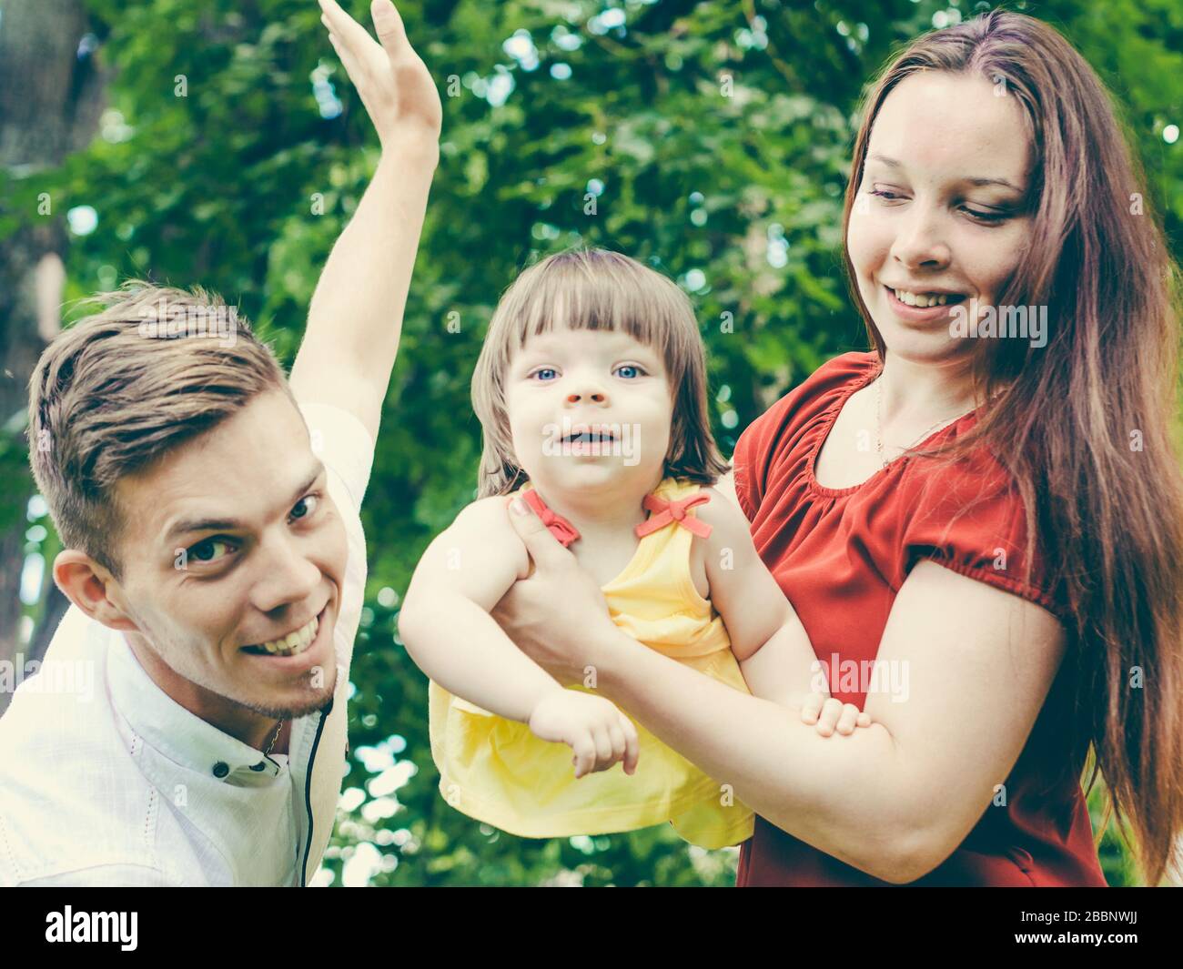 Family having fun at park in summer Stock Photo