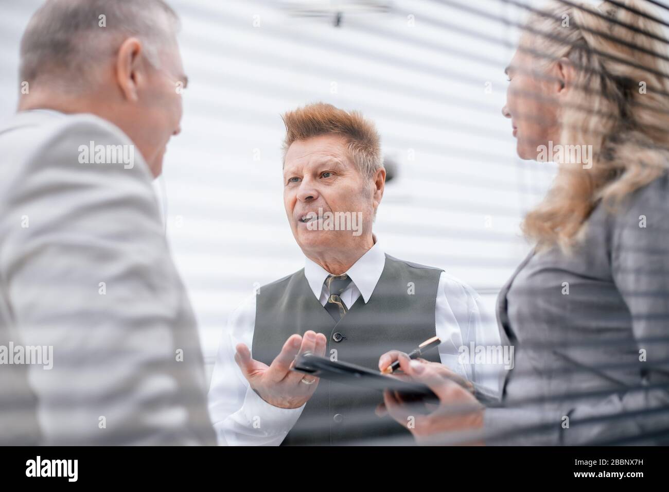 Business partners discussing issues in hi-res stock photography and ...