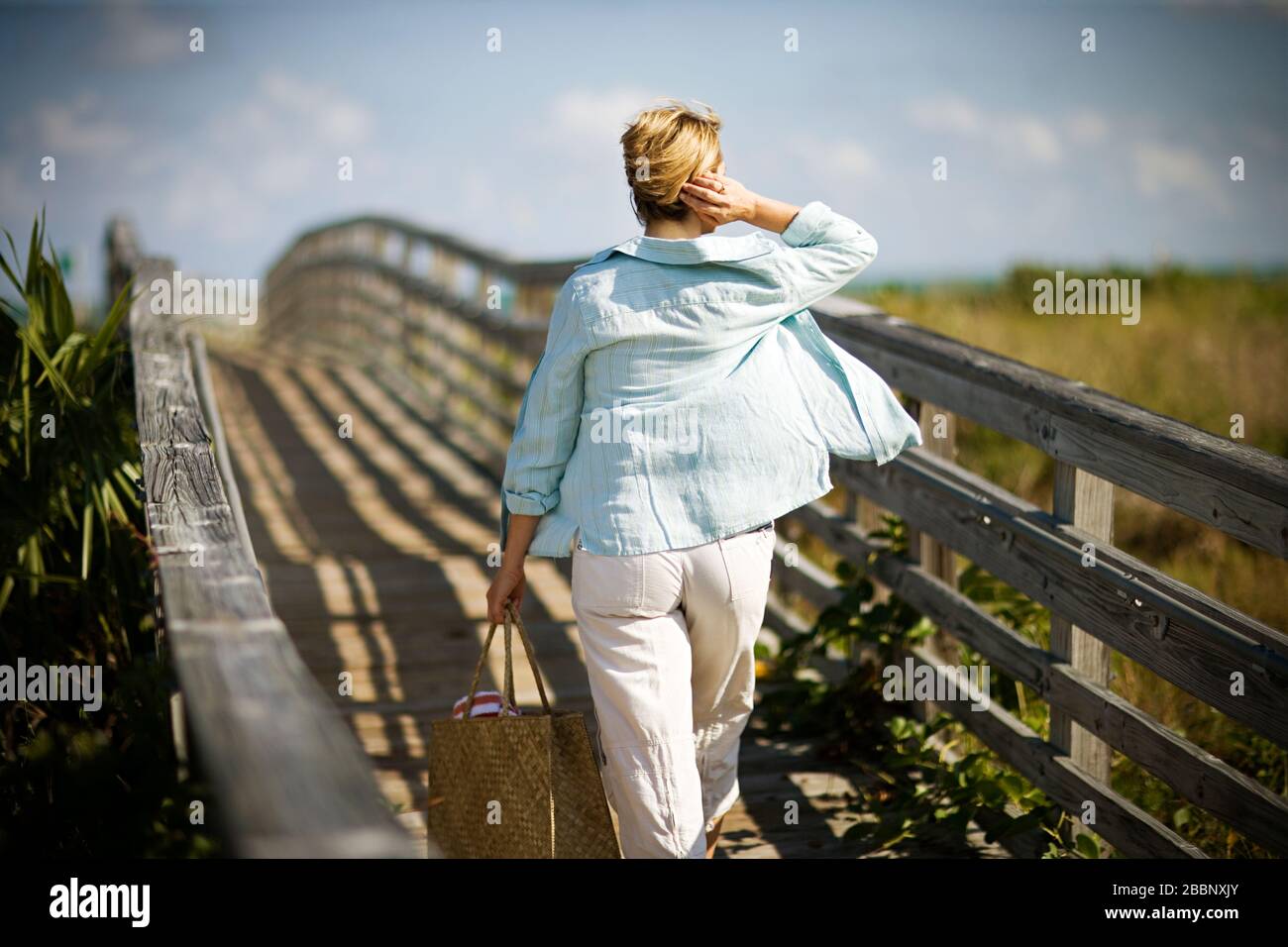 Mature woman walking wind hi-res stock photography and images - Alamy