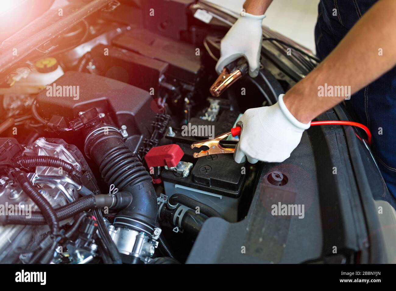 Mechanic working in auto repair shop Stock Photo - Alamy