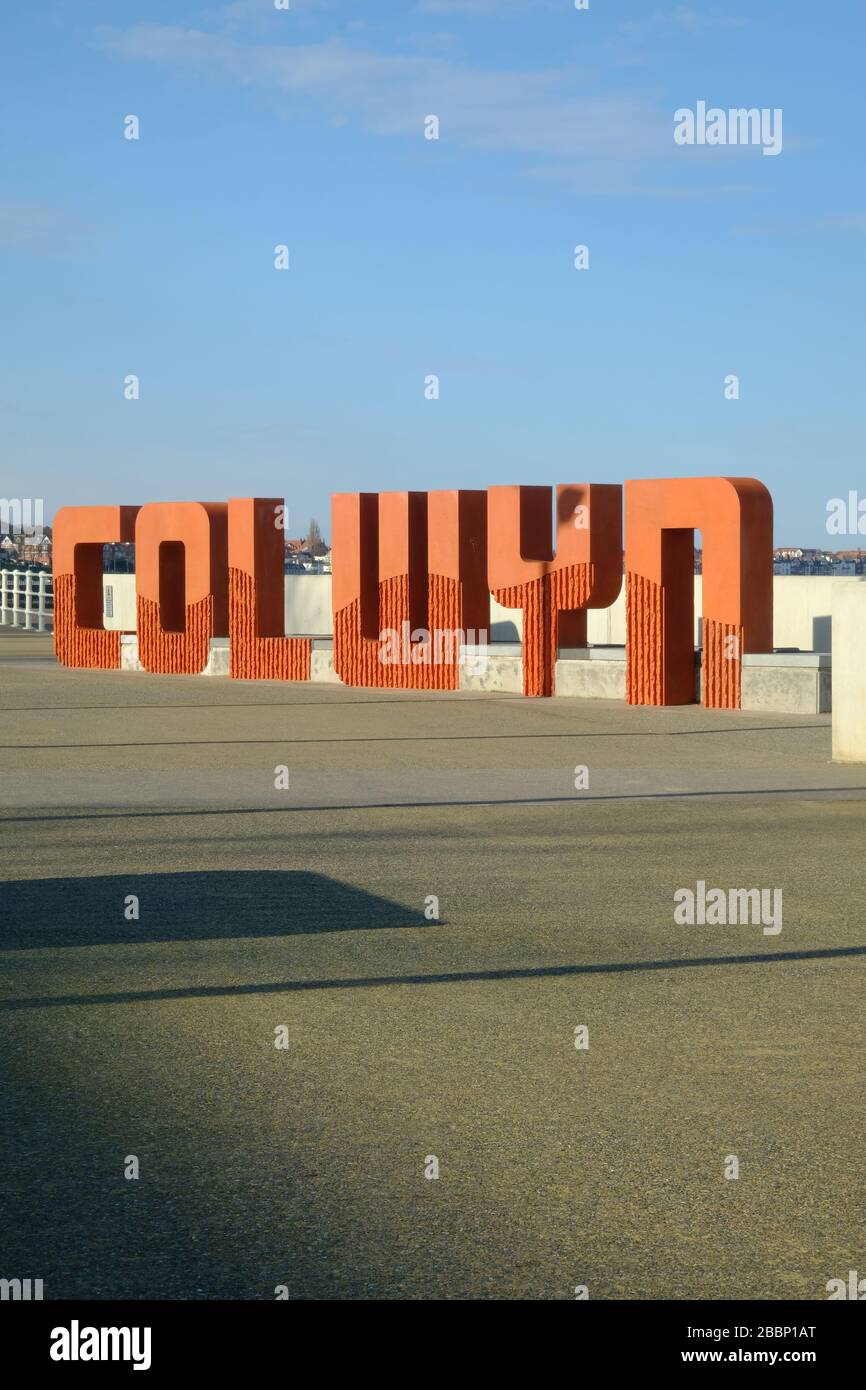 Large sign reading Colwyn in large letters on the sea front at Colwyn Bay in North Wales Stock Photo
