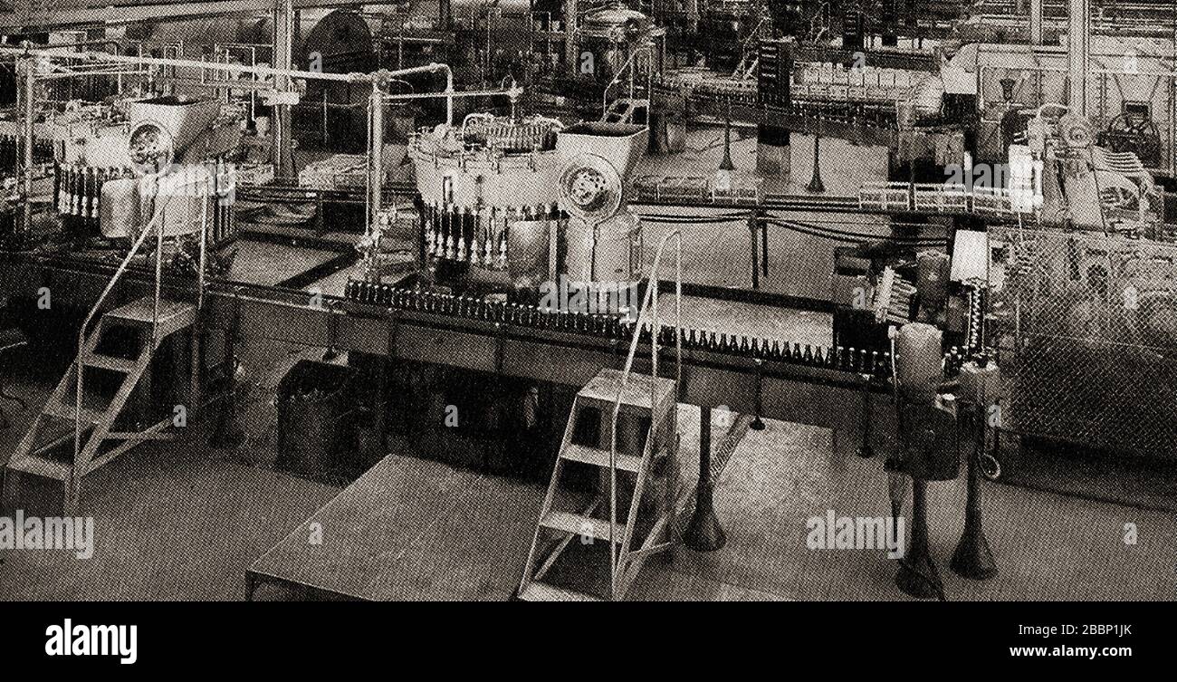 A 1930's view of the bottling plant at Ind Coope  & Allsopp. In 1799,   Edward Ind acquired the Star Brewery in Romford, Essex,  England that had previously been founded by George Cardon in 1709. Stock Photo