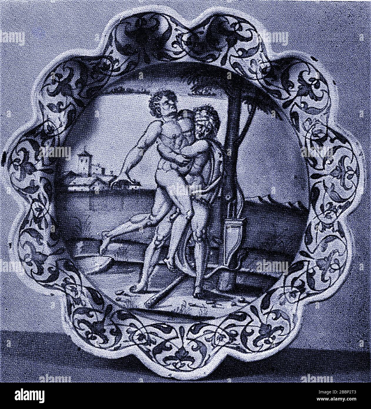 An early printed photograph showing Hercules fighting Antaeus on an Italian Faience dish. Faience is the British name for any fine tin-glazed pottery on a buff earthenware body. Historically Antaeus would challenge anyone to wrestling matches and remained invincible as long as he remained in contact with his mother, ( the earth ). Antaeus fought Heracles as he was on his way to the Garden of Hesperides as his 11th Labour but was defeated by Hercules who crushed him to death. Antaeus was supposedly king of the city Irassa in Libya Stock Photo